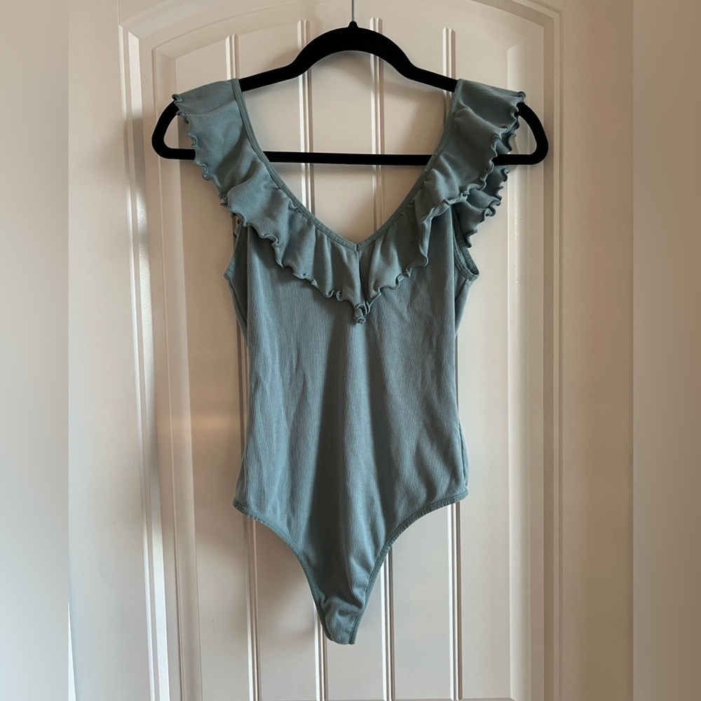 Aritzia ruffle tank body suit in light blue. Size medium.